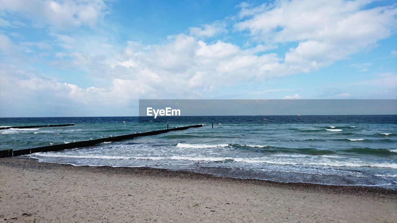 Scenic view of beach against sky