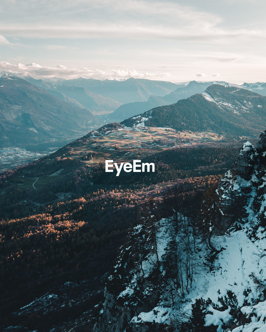 Aerial view of snowcapped mountains against sky