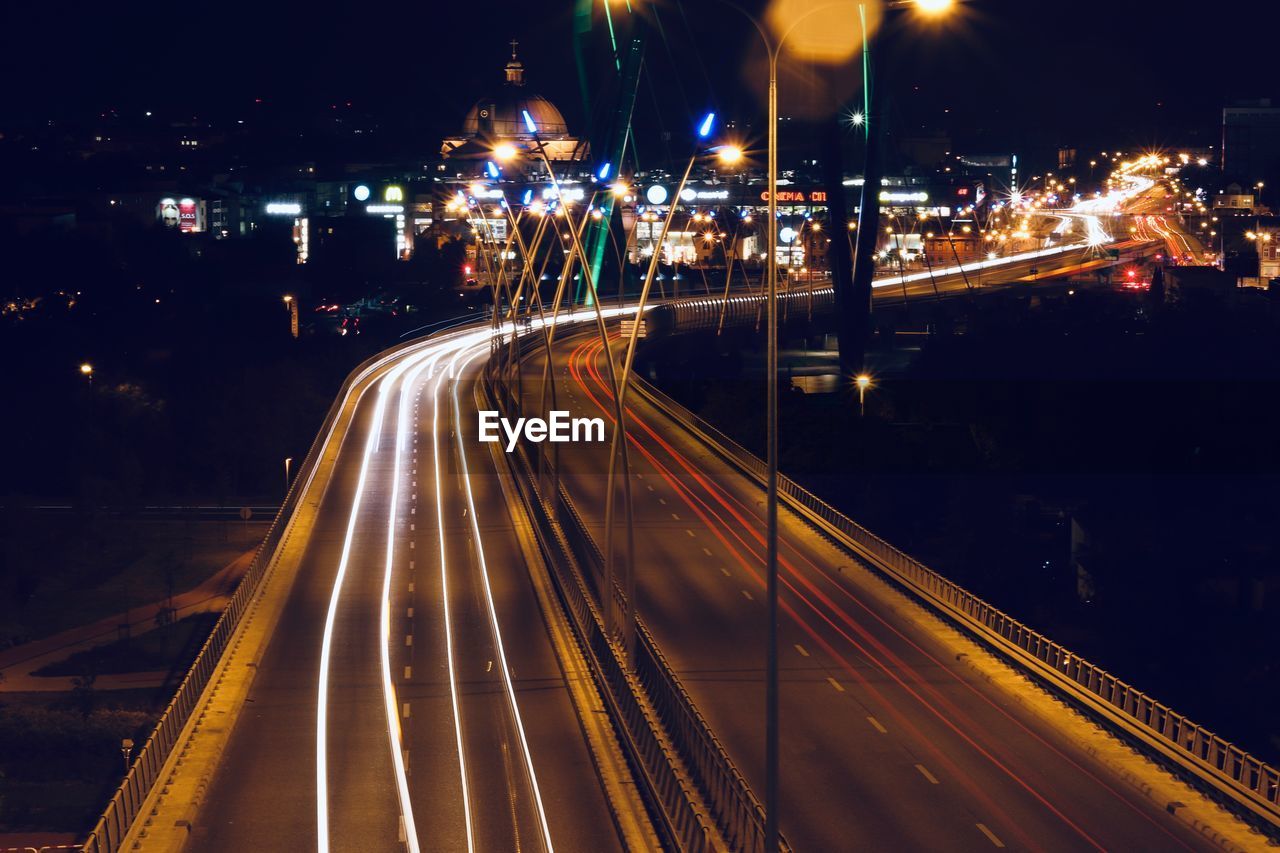 High angle view of light trails on road at night