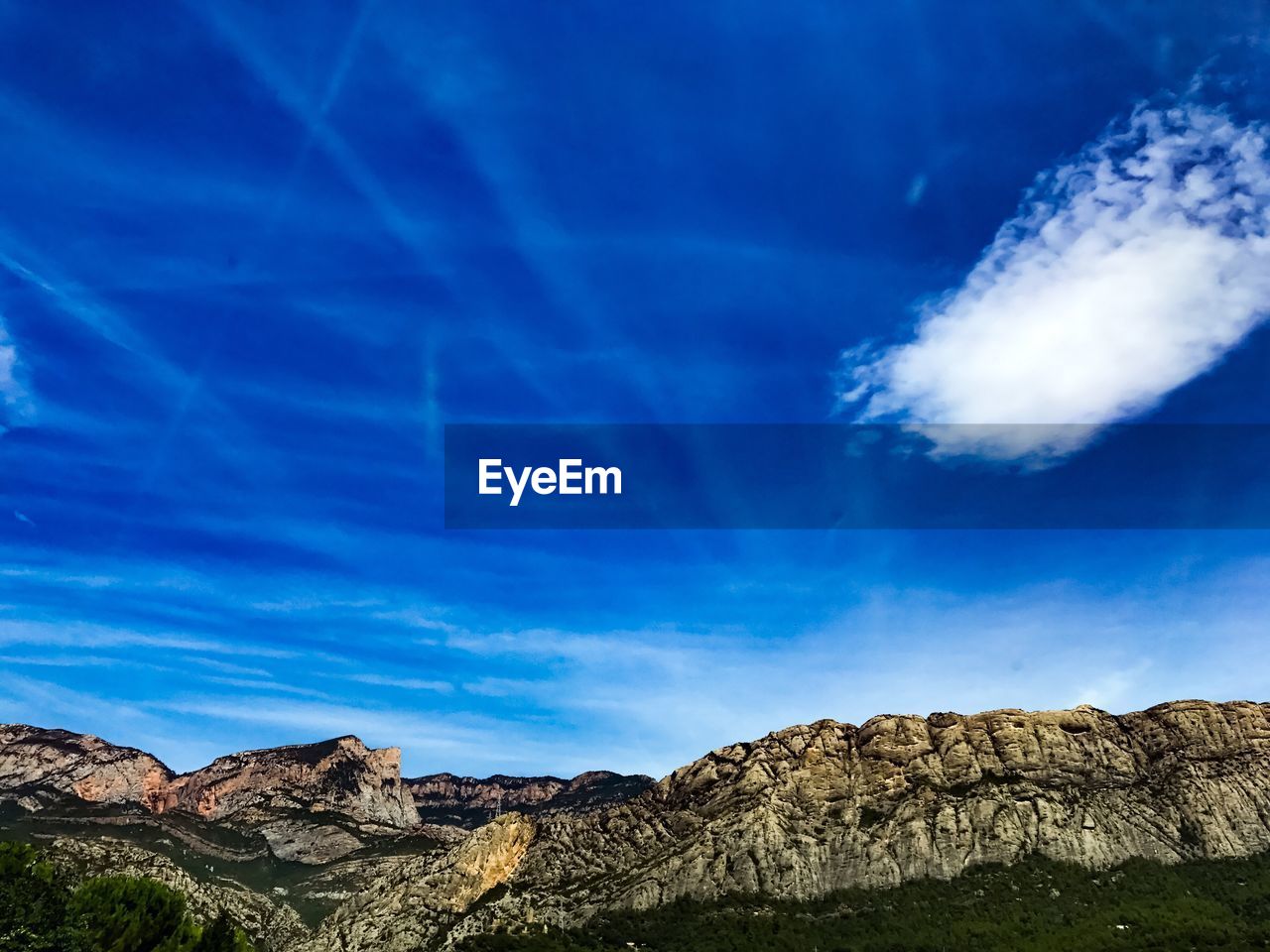 Low angle view of rock formations against blue sky