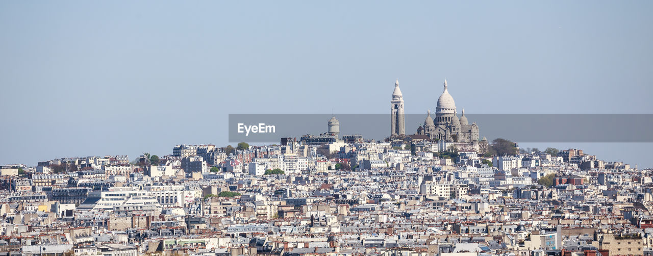 Cityscape against clear sky