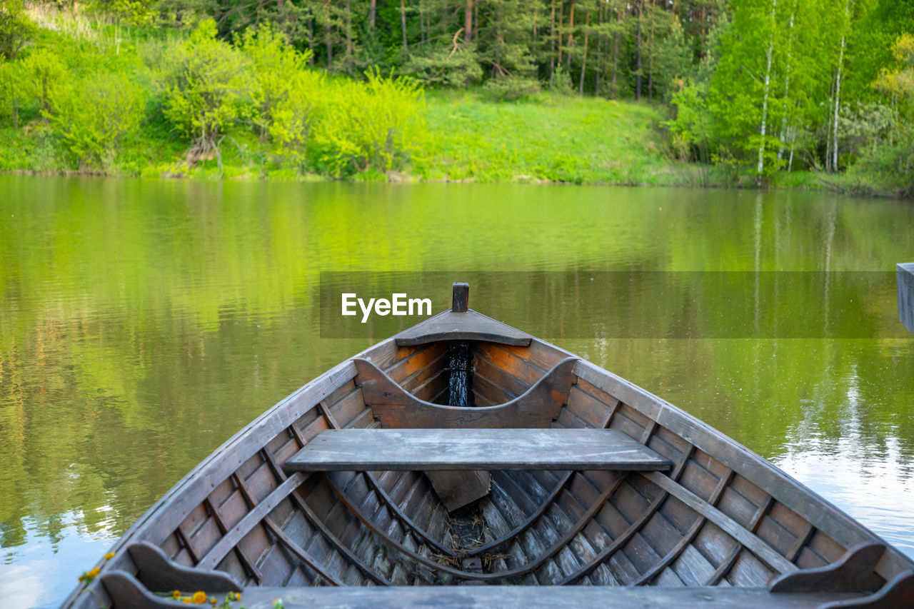 WOODEN BOAT IN LAKE