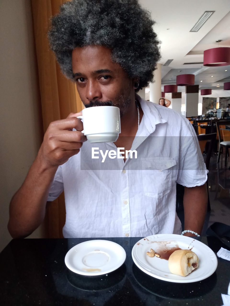 Portrait of man having coffee