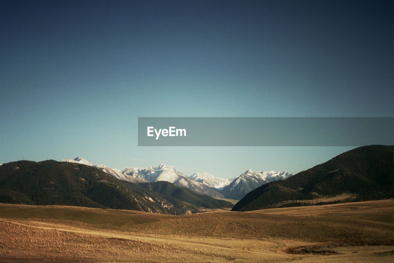 Scenic view of mountains against clear sky