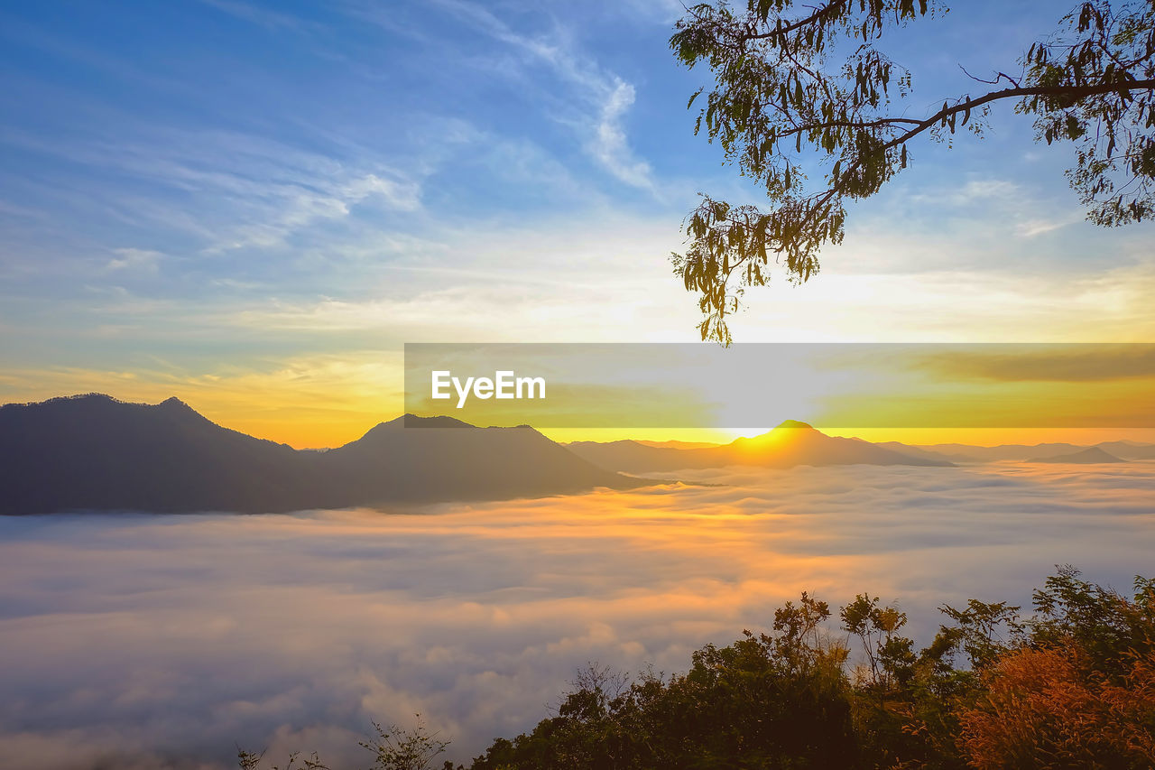 Scenic view of mountains against sky during sunset