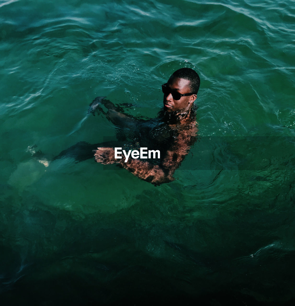 High angle view of man swimming in sea