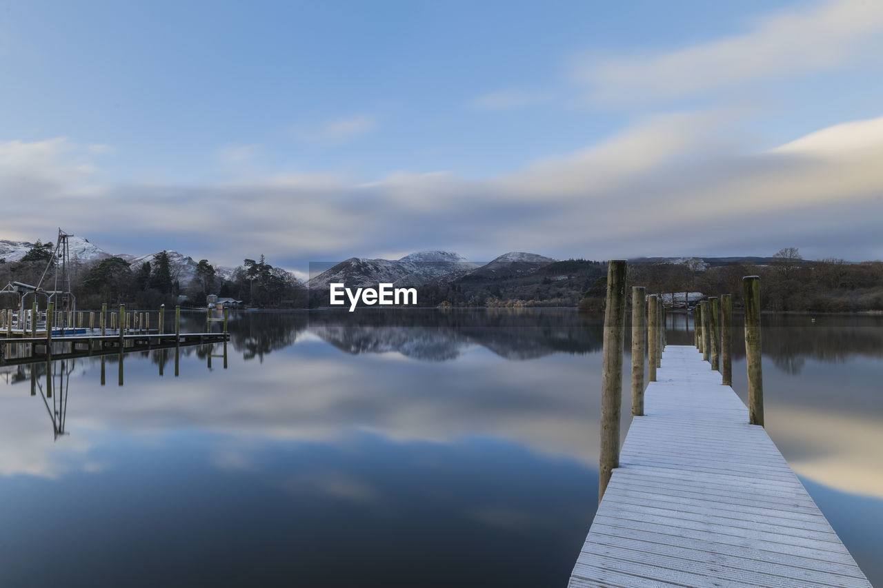 Scenic view of lake against sky during winter