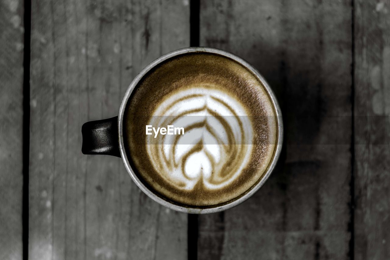 CLOSE-UP OF COFFEE CUP ON TABLE