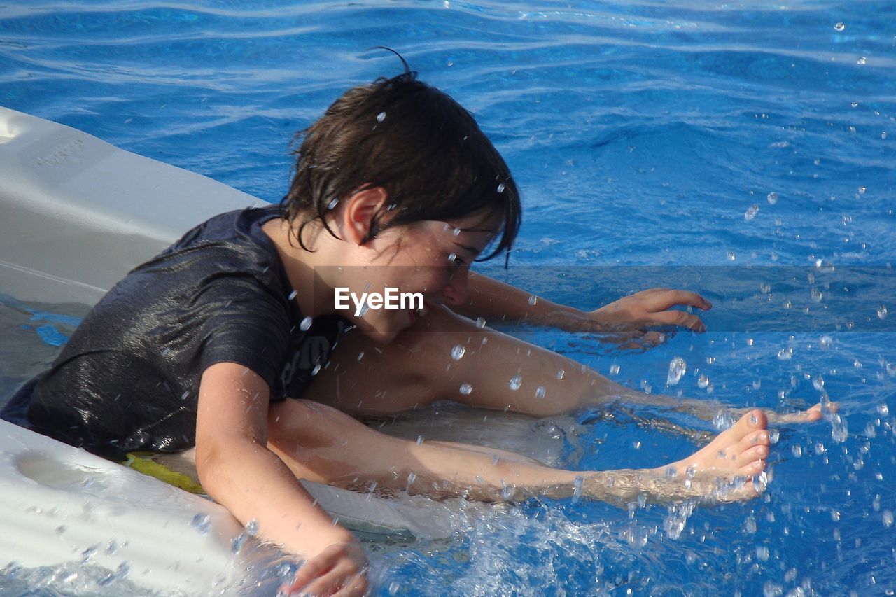 Boy in swimming pool