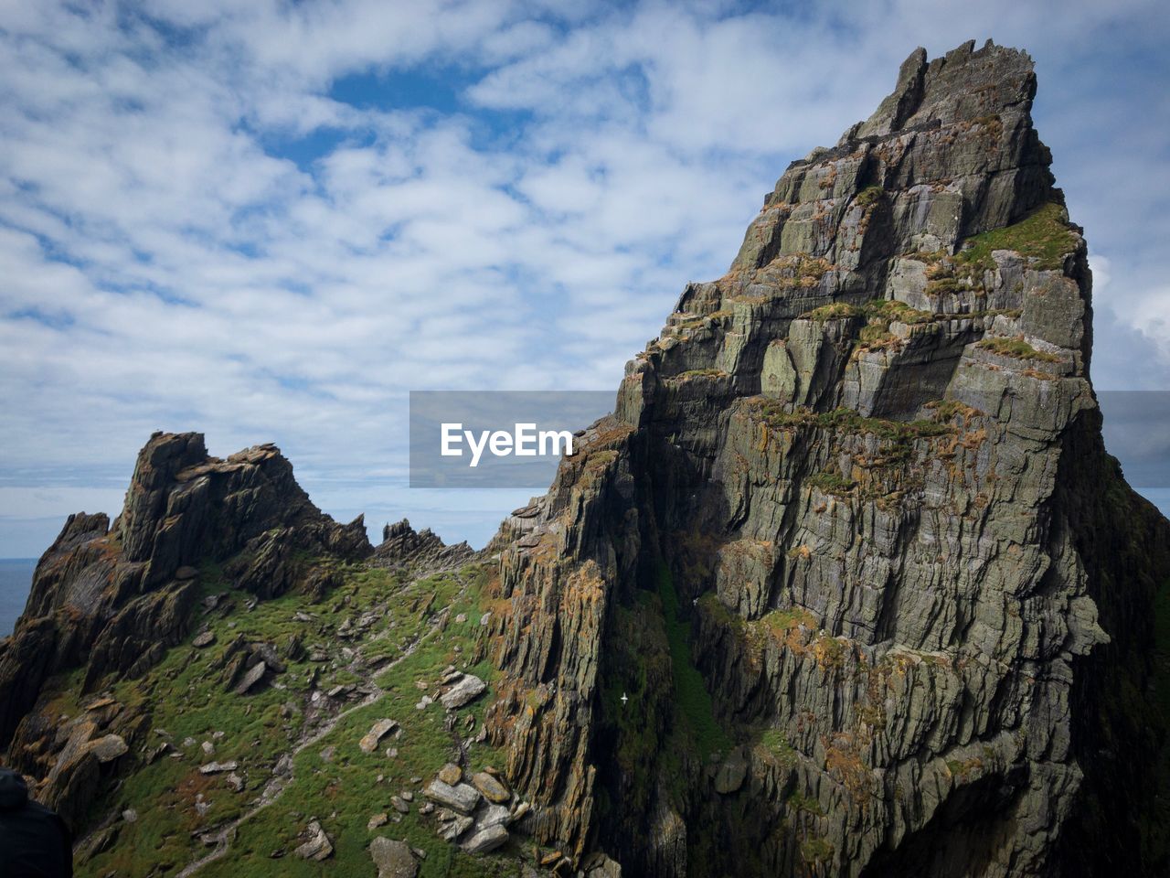 Low angle view of rock formations against sky