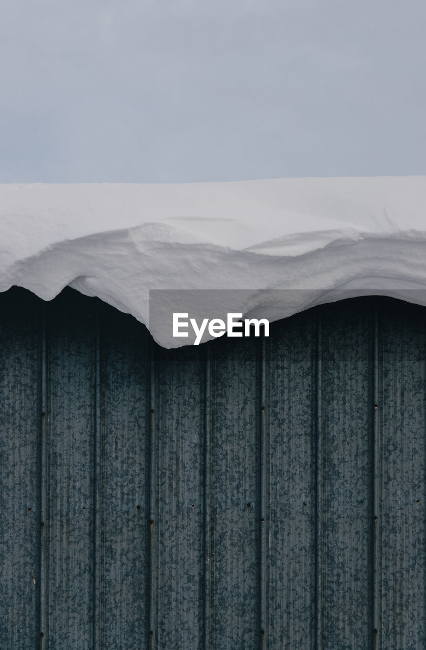 Snow hanging off roof.