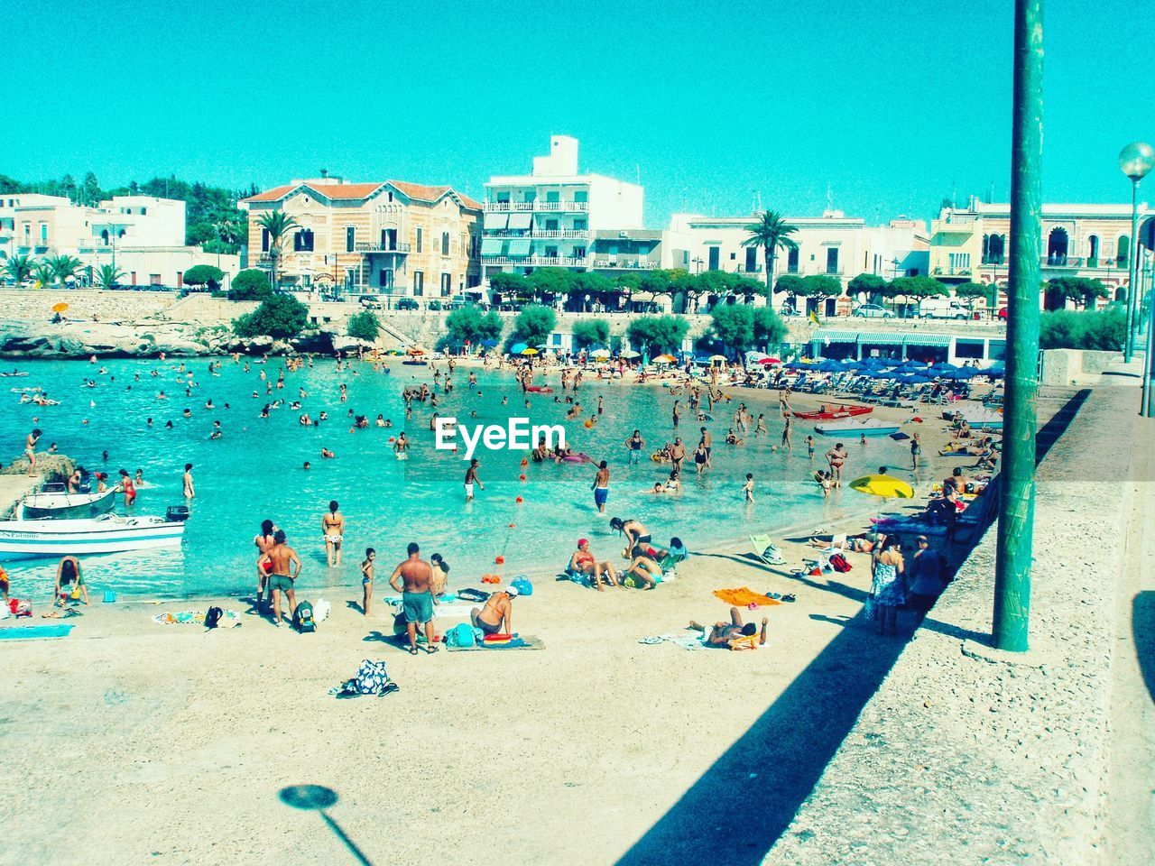 Group of people on beach in city