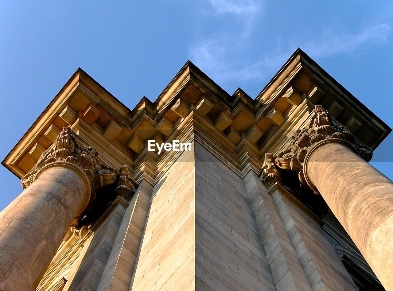 Low angle view of built structure against blue sky