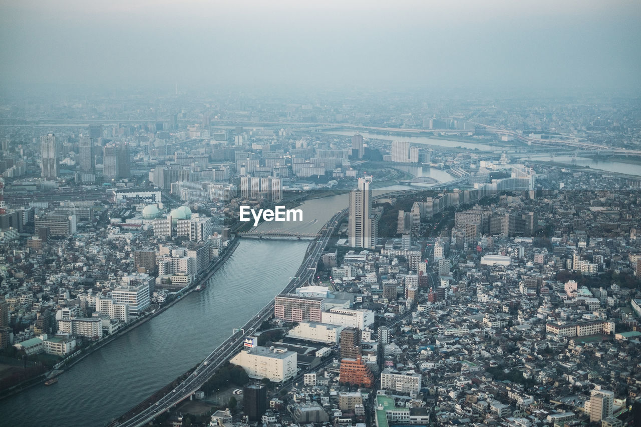 Aerial view of cityscape against sky