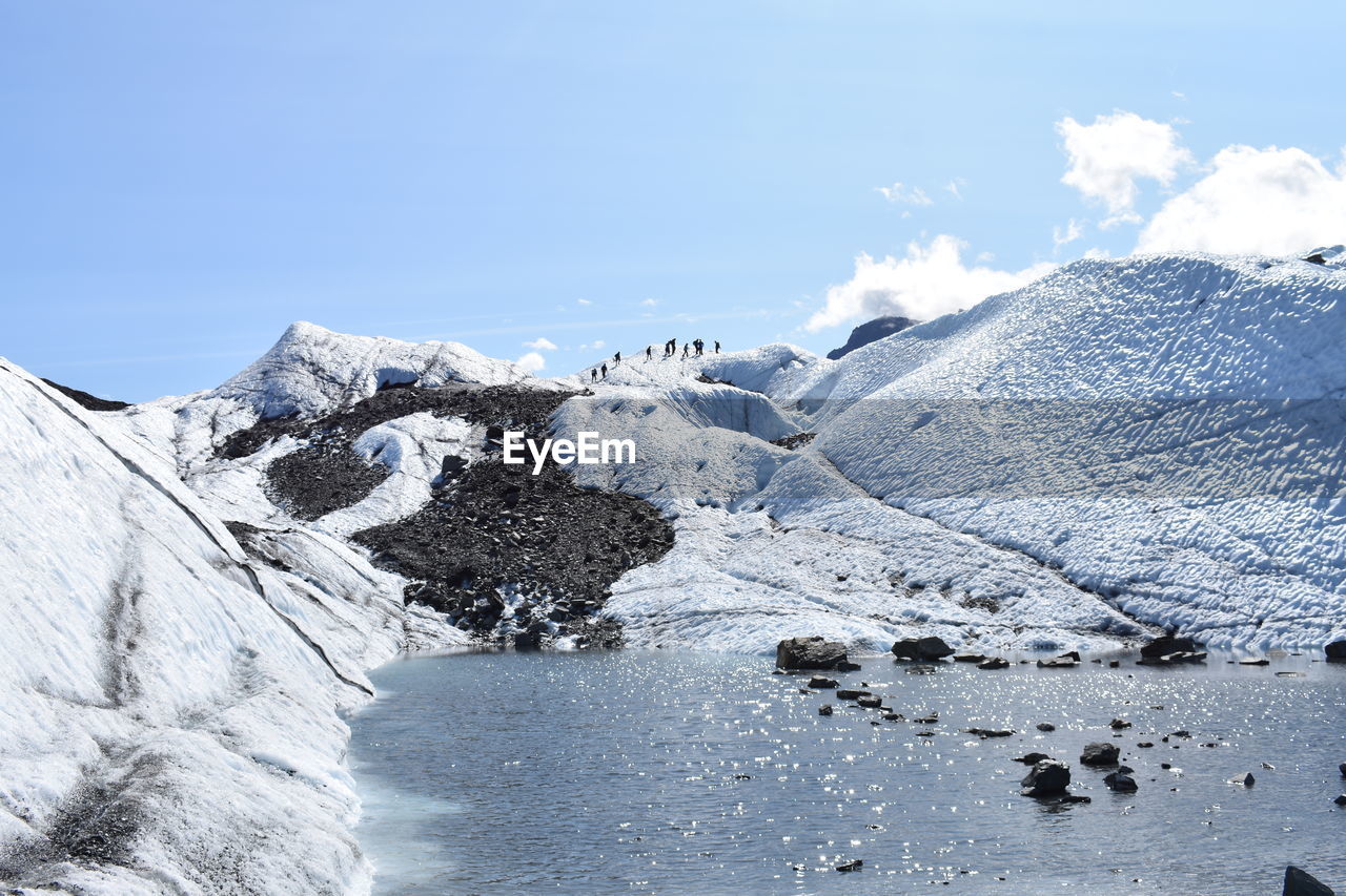 SCENIC VIEW OF SNOWCAPPED MOUNTAIN AGAINST SKY DURING WINTER