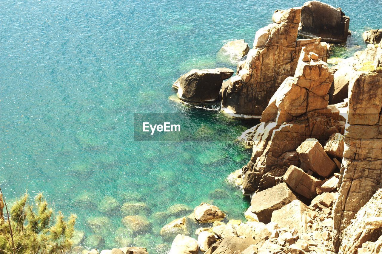 High angle view of rock formation in sea