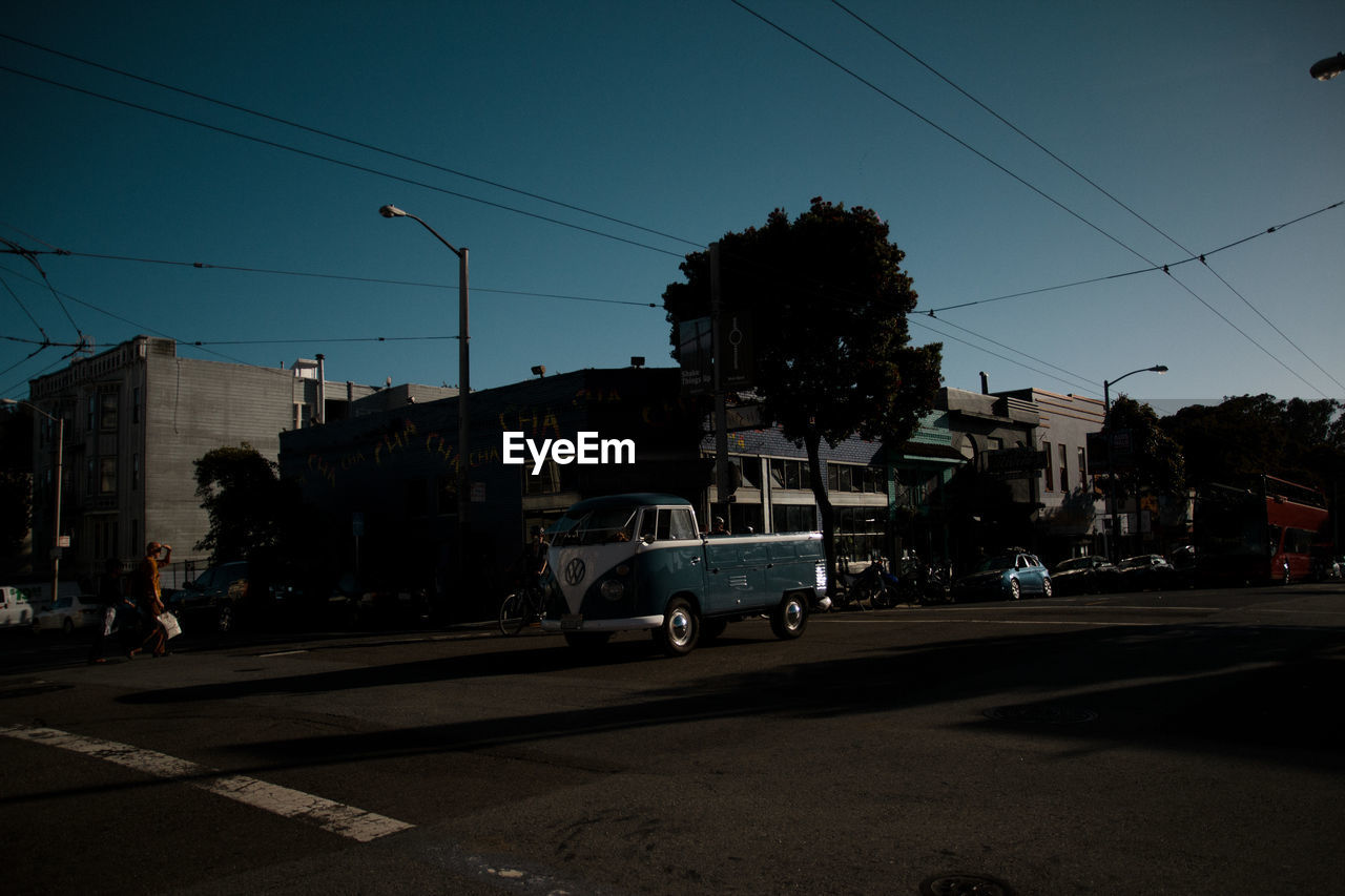 View of van on road against buildings
