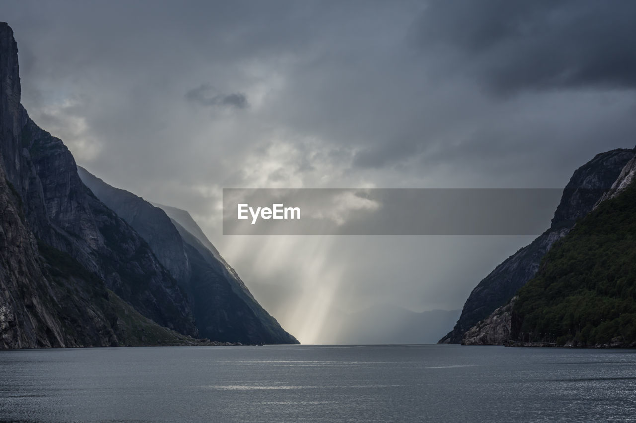 Scenic view of lysefjord and mountains against sky