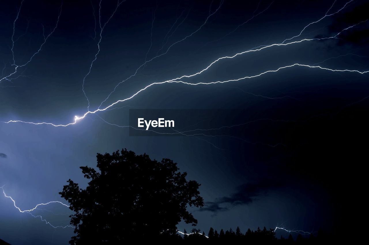 Low angle view of lightning at night