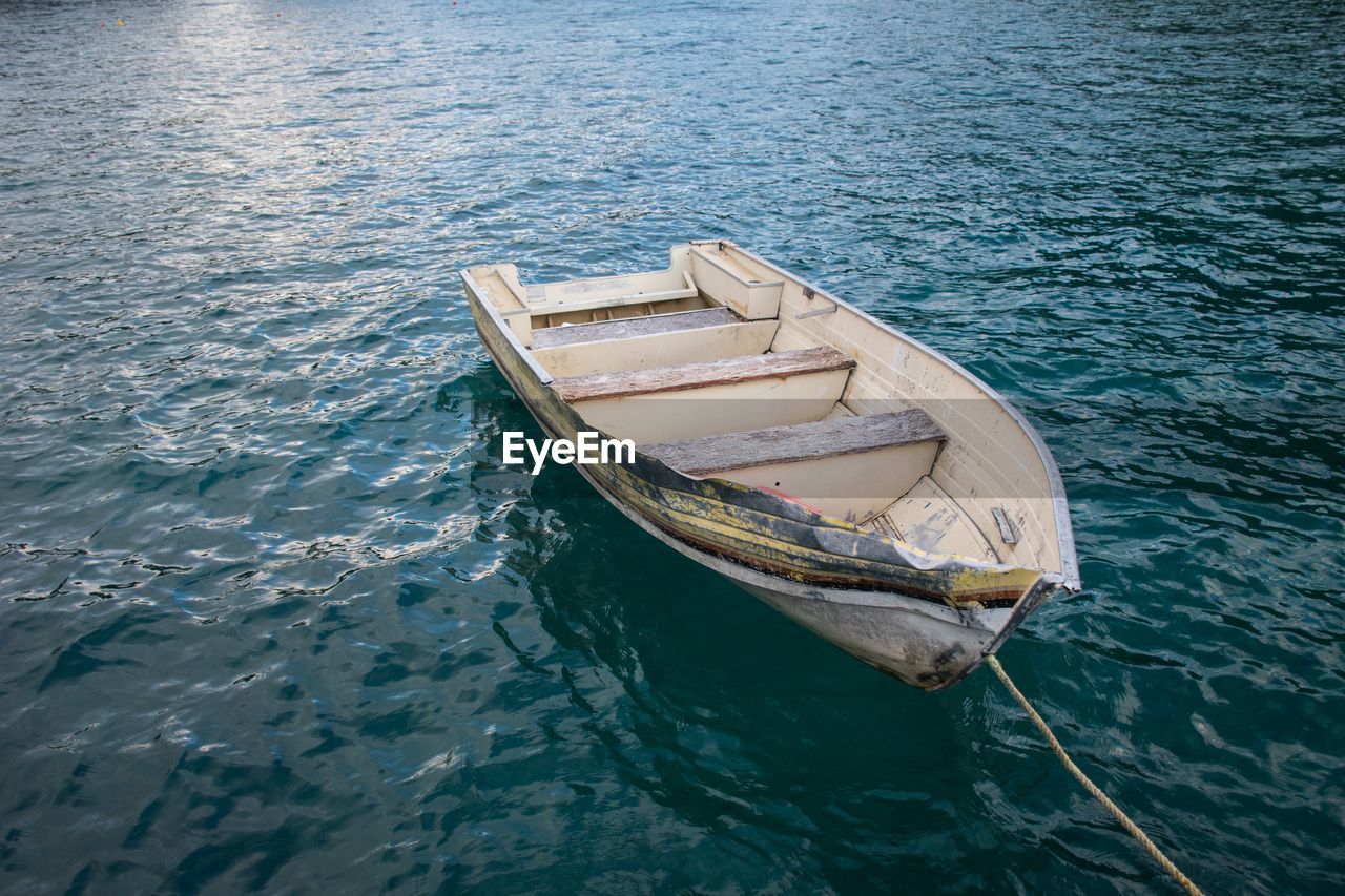 Boat moored in calm lake