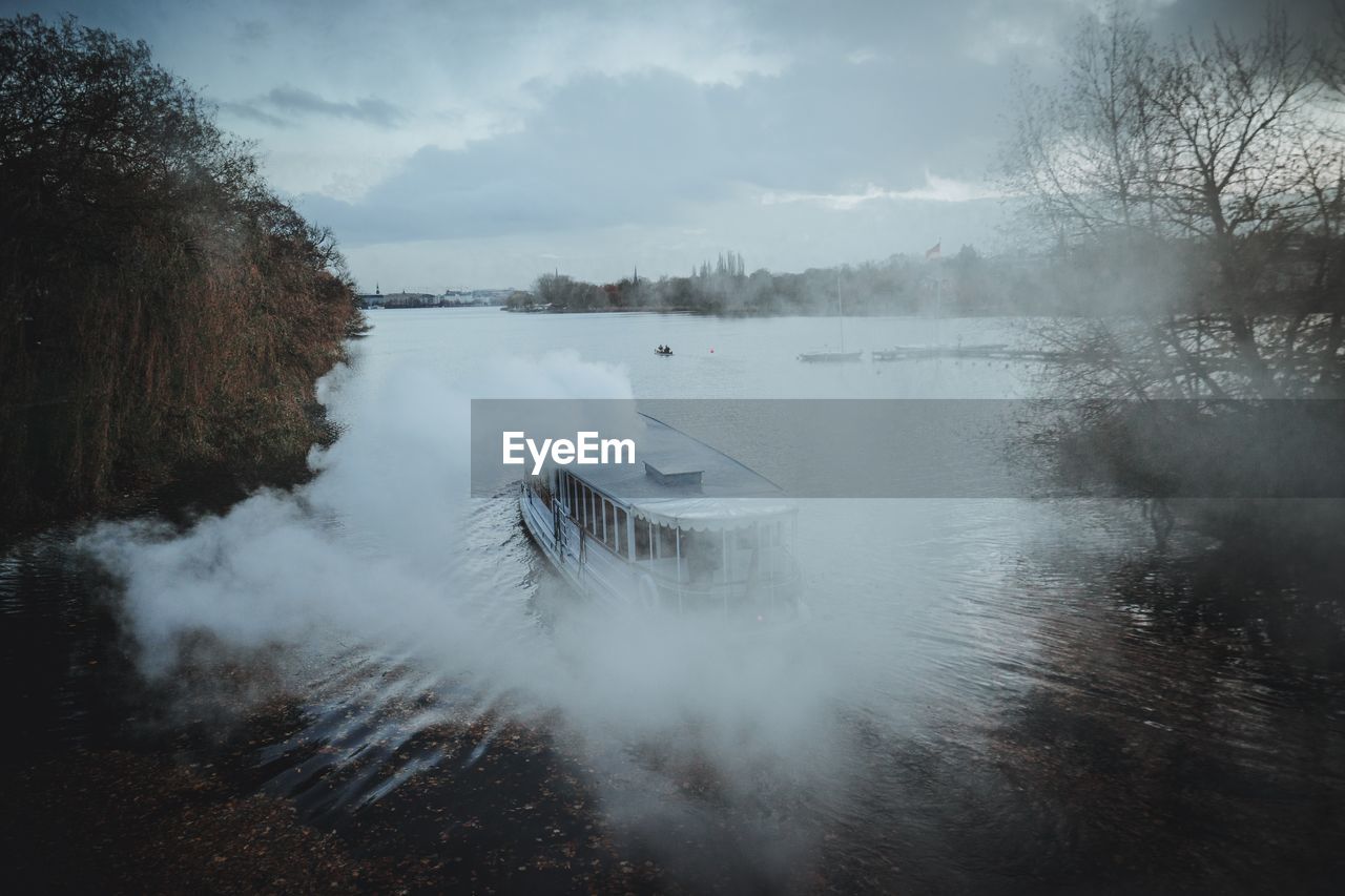 FROZEN LAKE AGAINST SKY