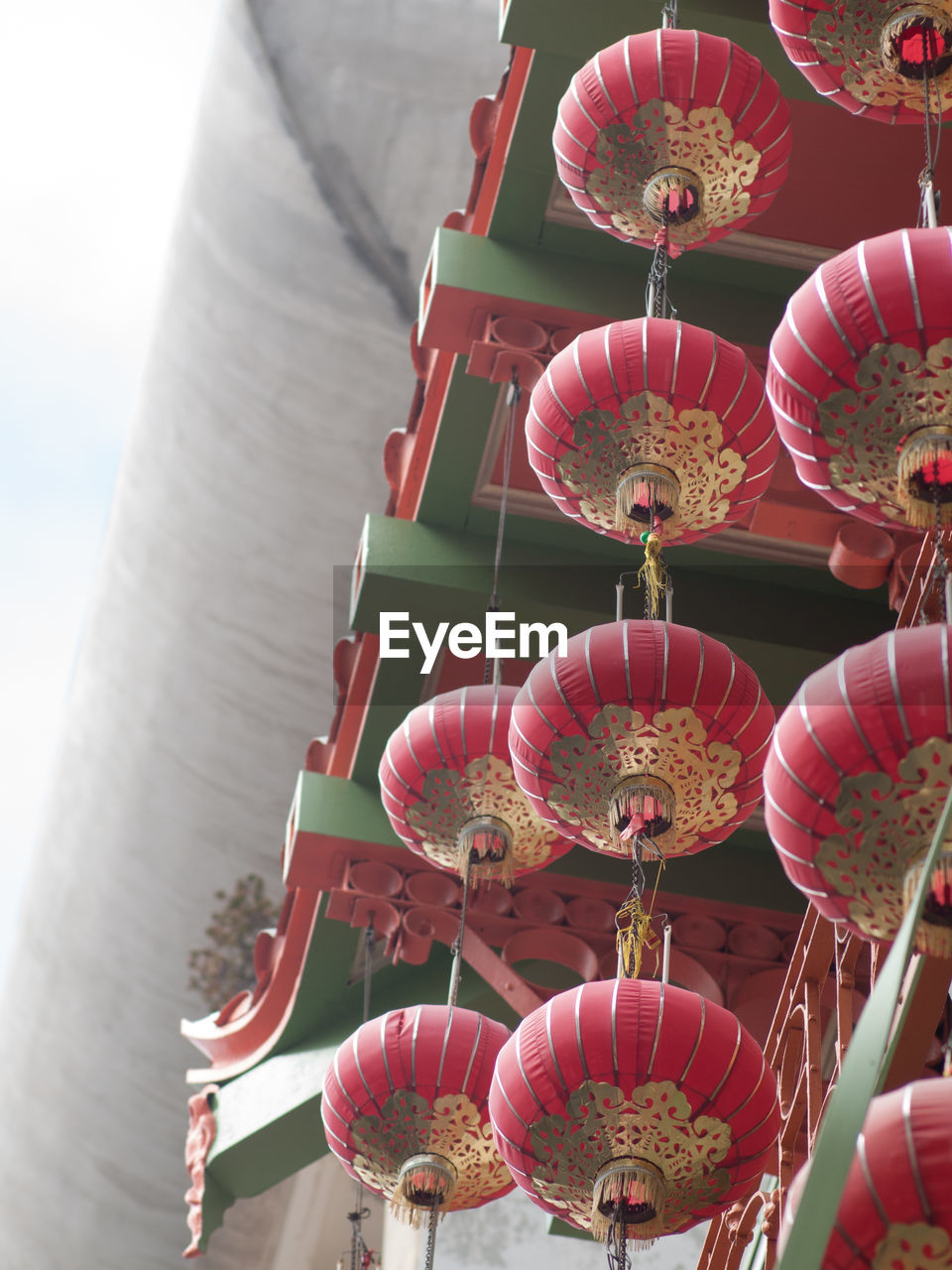 LOW ANGLE VIEW OF LANTERN HANGING ON BUILDING