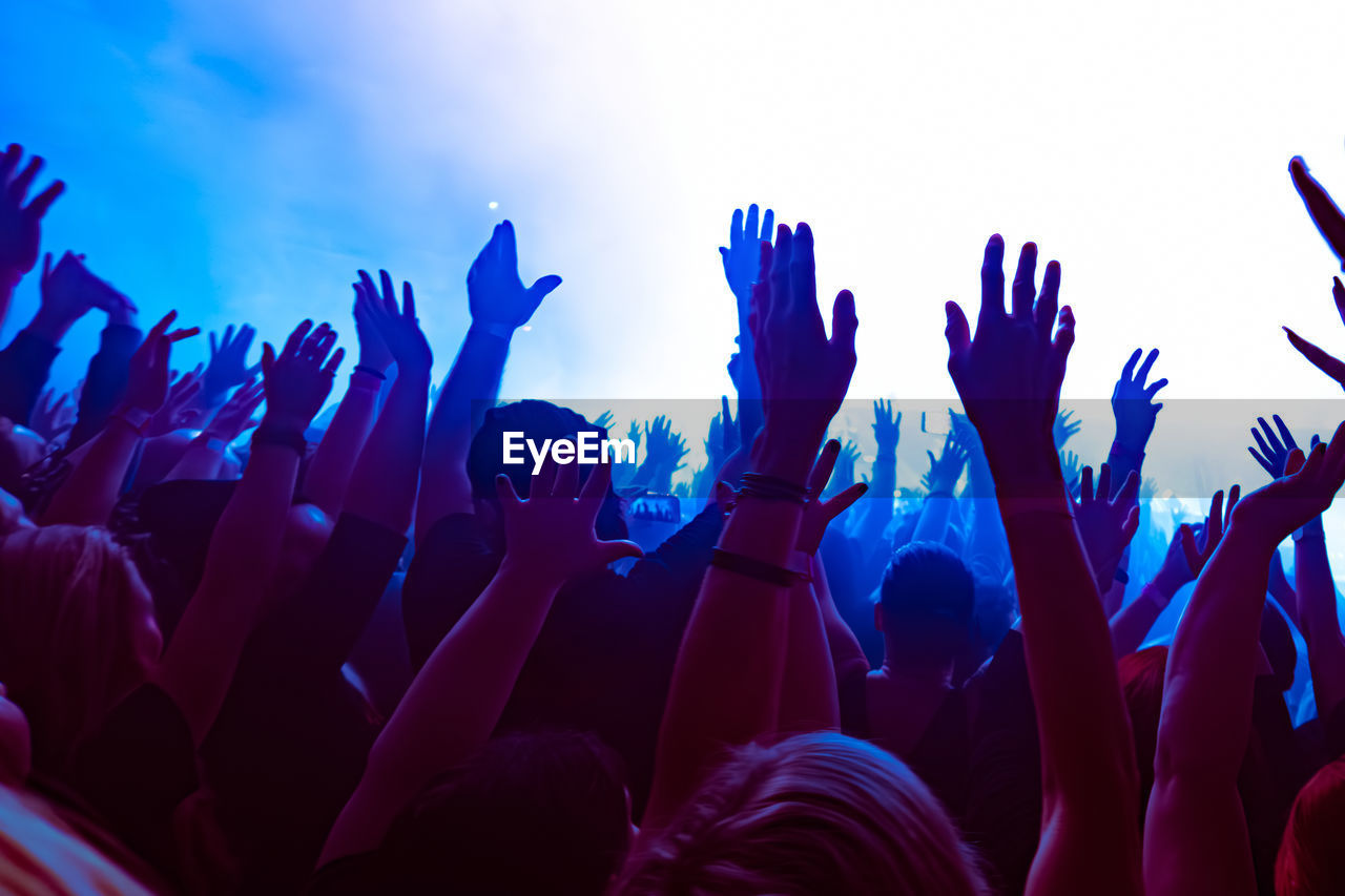 Crowd of people dancing at concert