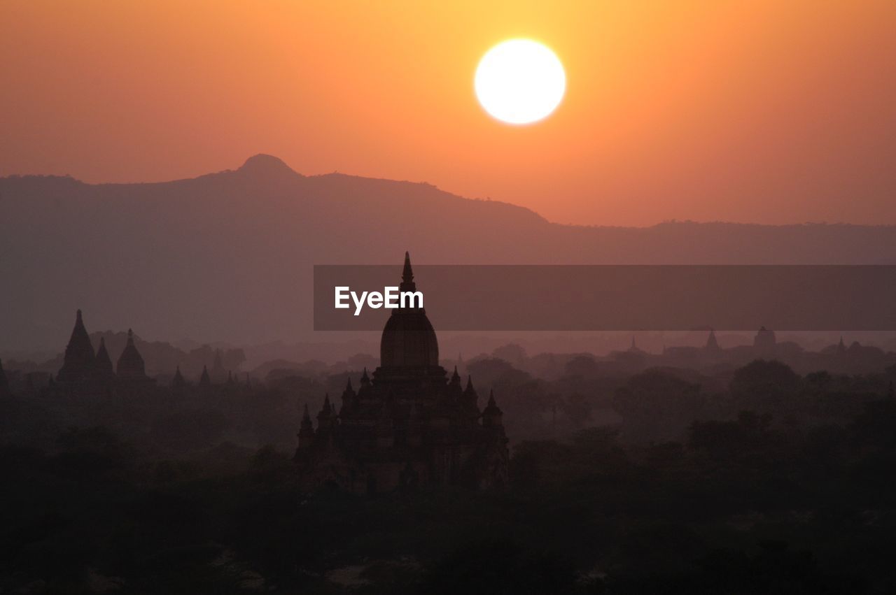 Historic temple against clear sky at sunset