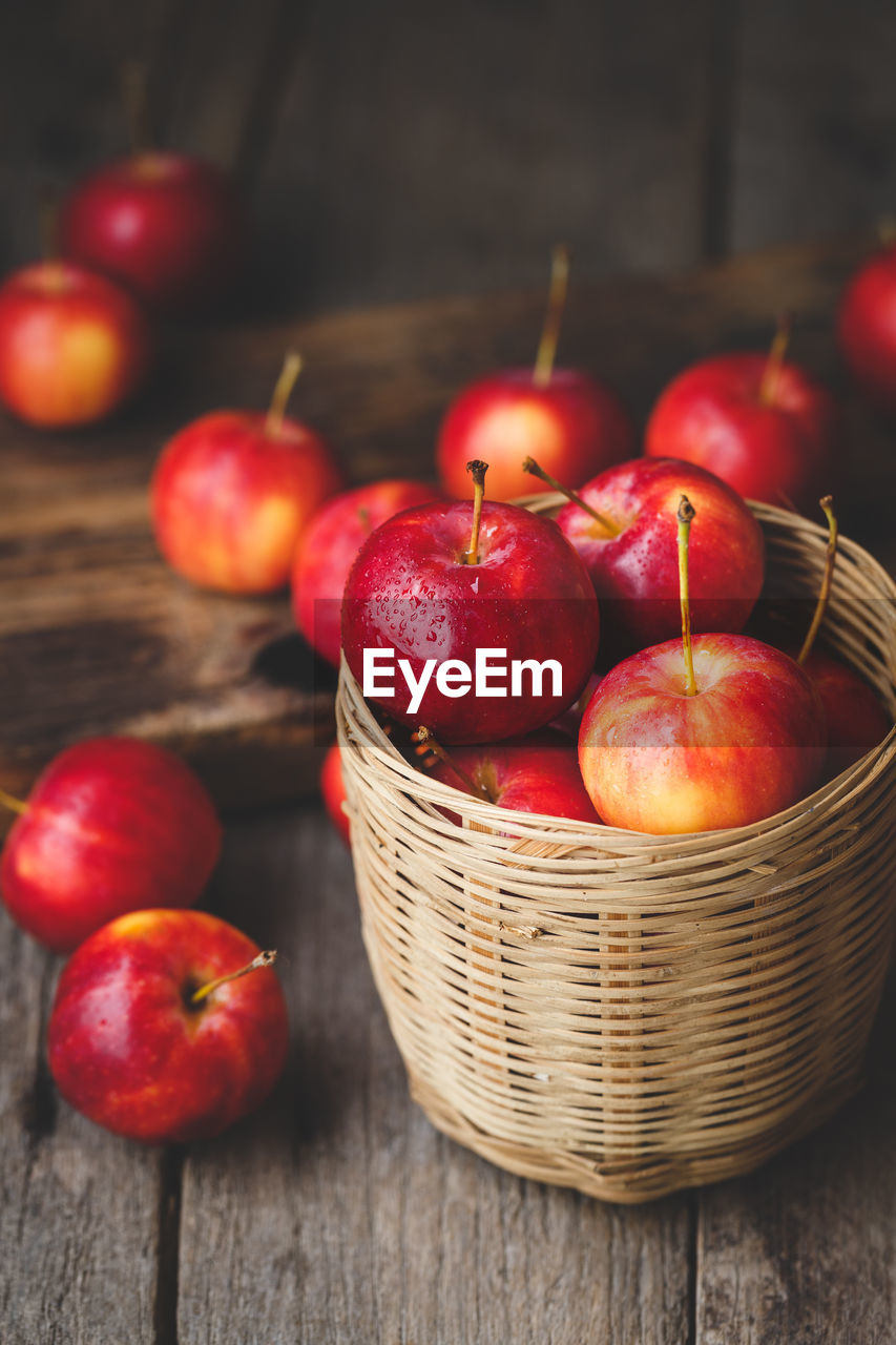 Close-up of apples in basket on table