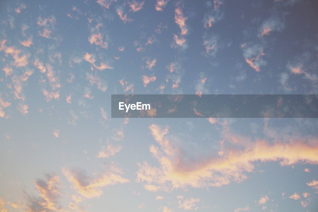 LOW ANGLE VIEW OF CLOUDS IN SKY AT SUNSET