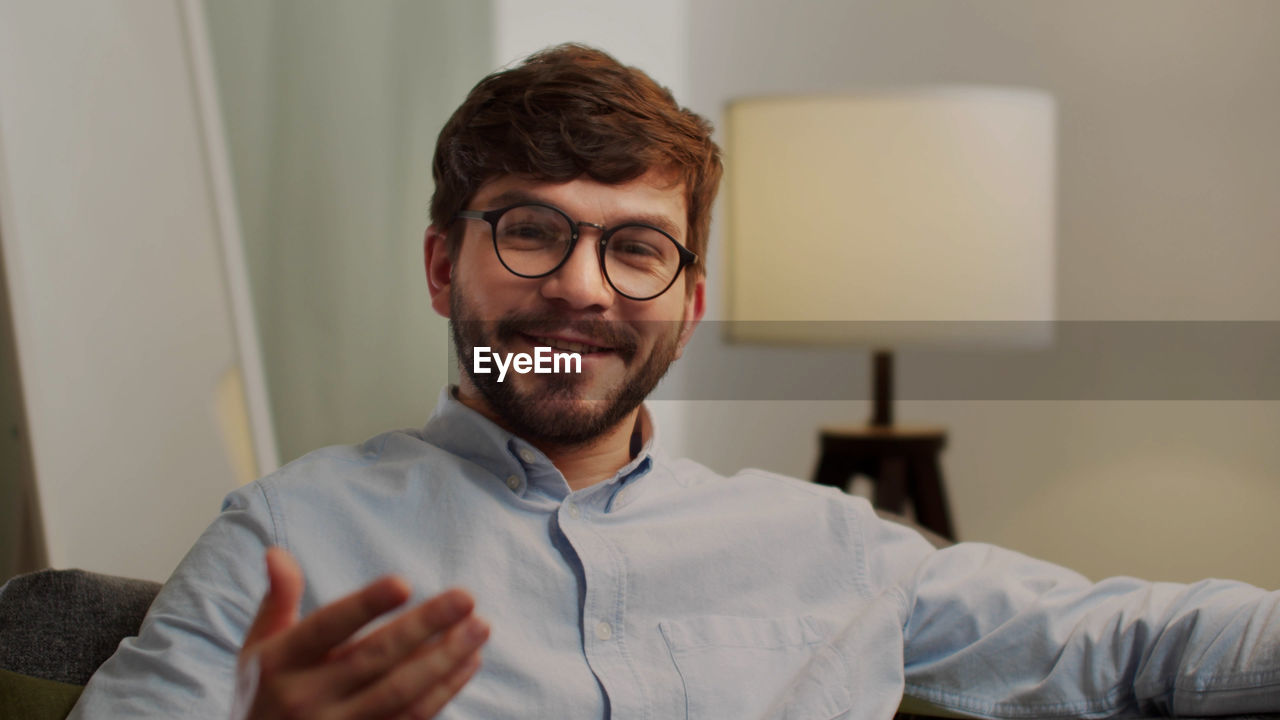 Portrait of man smiling at home