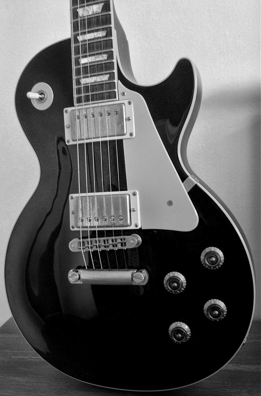 Close-up of guitar on table