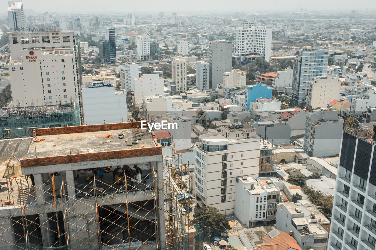 High angle view of buildings in city on sunny day