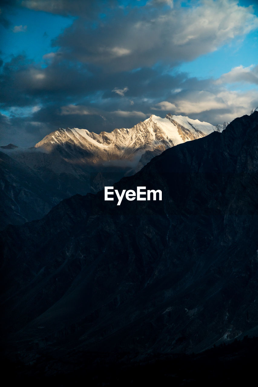 Scenic view of snowcapped mountains against sky