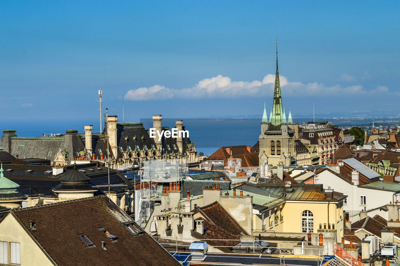 HIGH ANGLE VIEW OF BUILDINGS AGAINST SKY