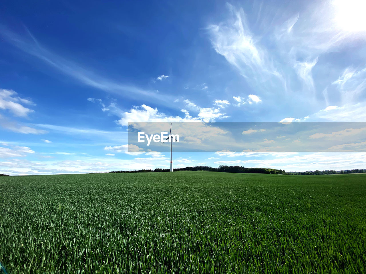 WINDMILL ON FIELD AGAINST SKY