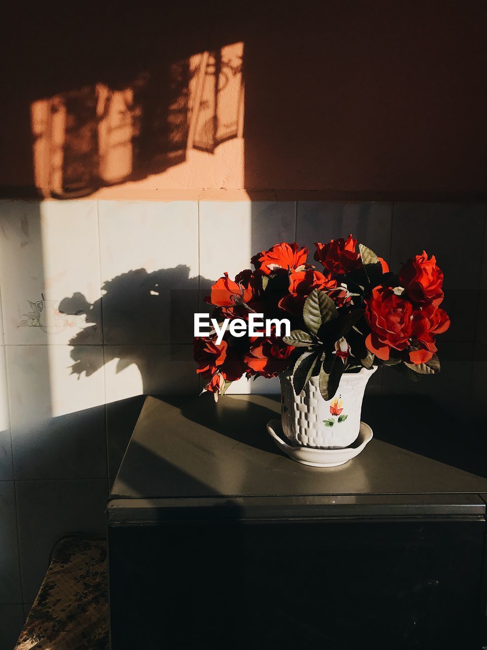 Close-up of flower vase on table at home