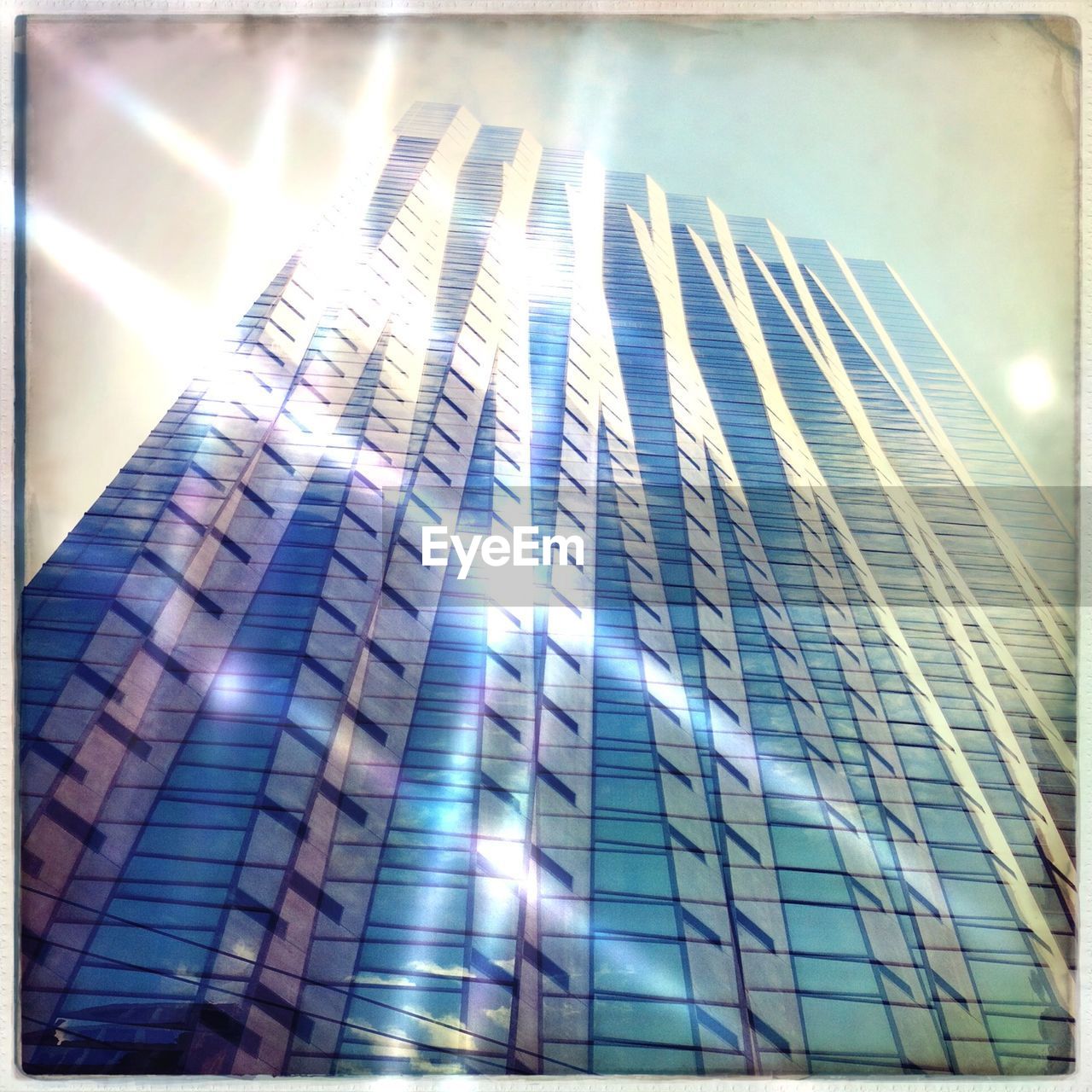 Low angle view of modern office building against sky