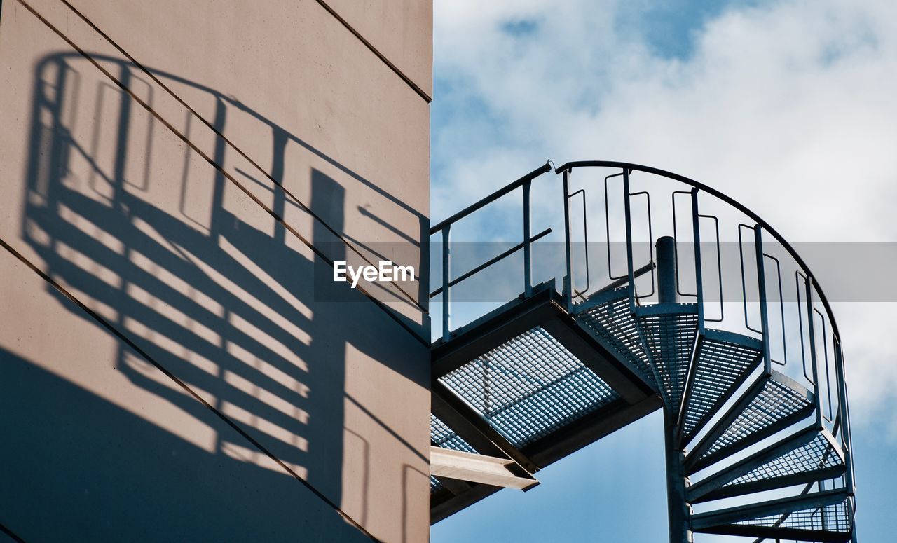 Low angle view of  spiral staircase against sky
