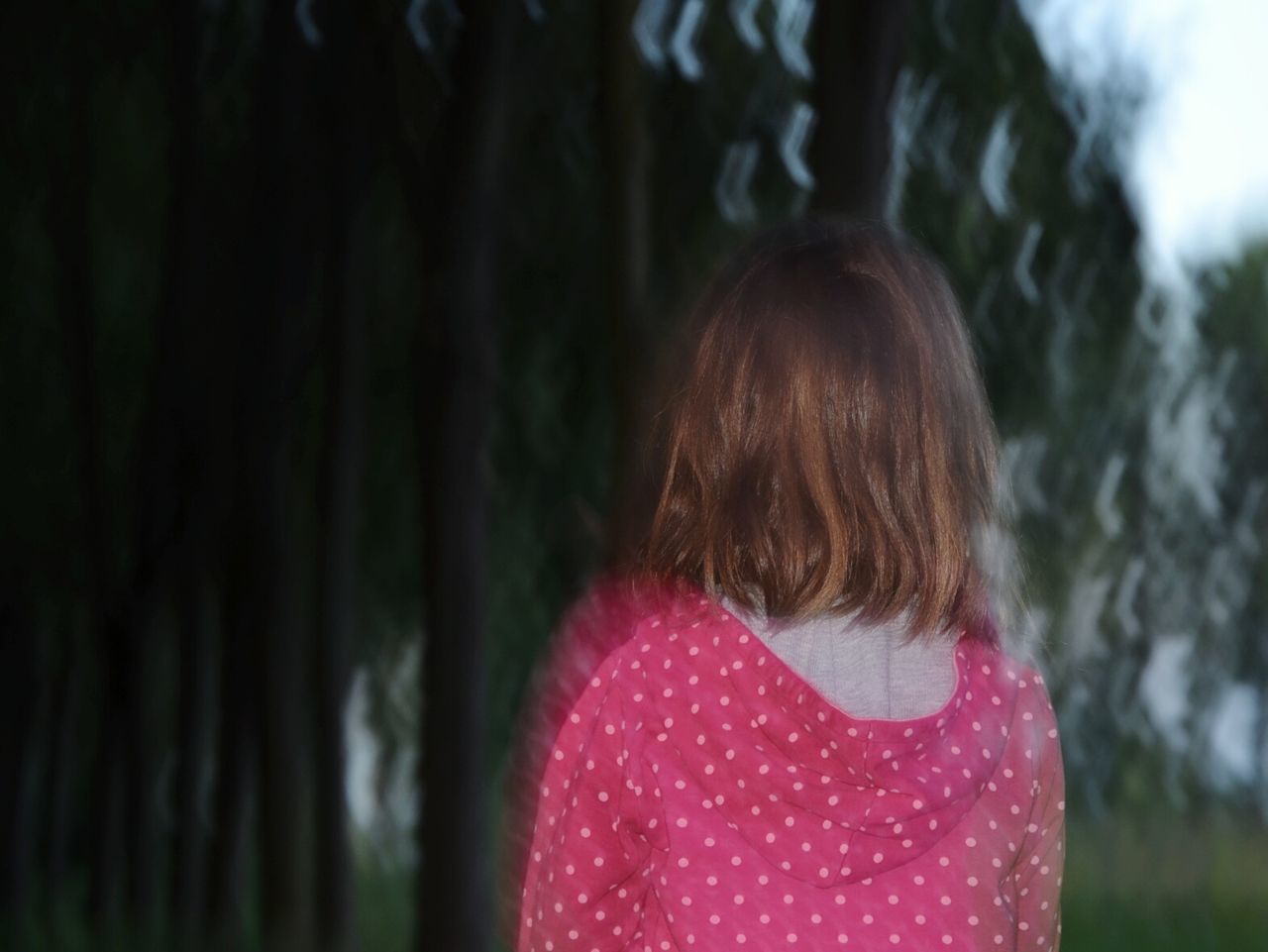 Rear view of girl in park