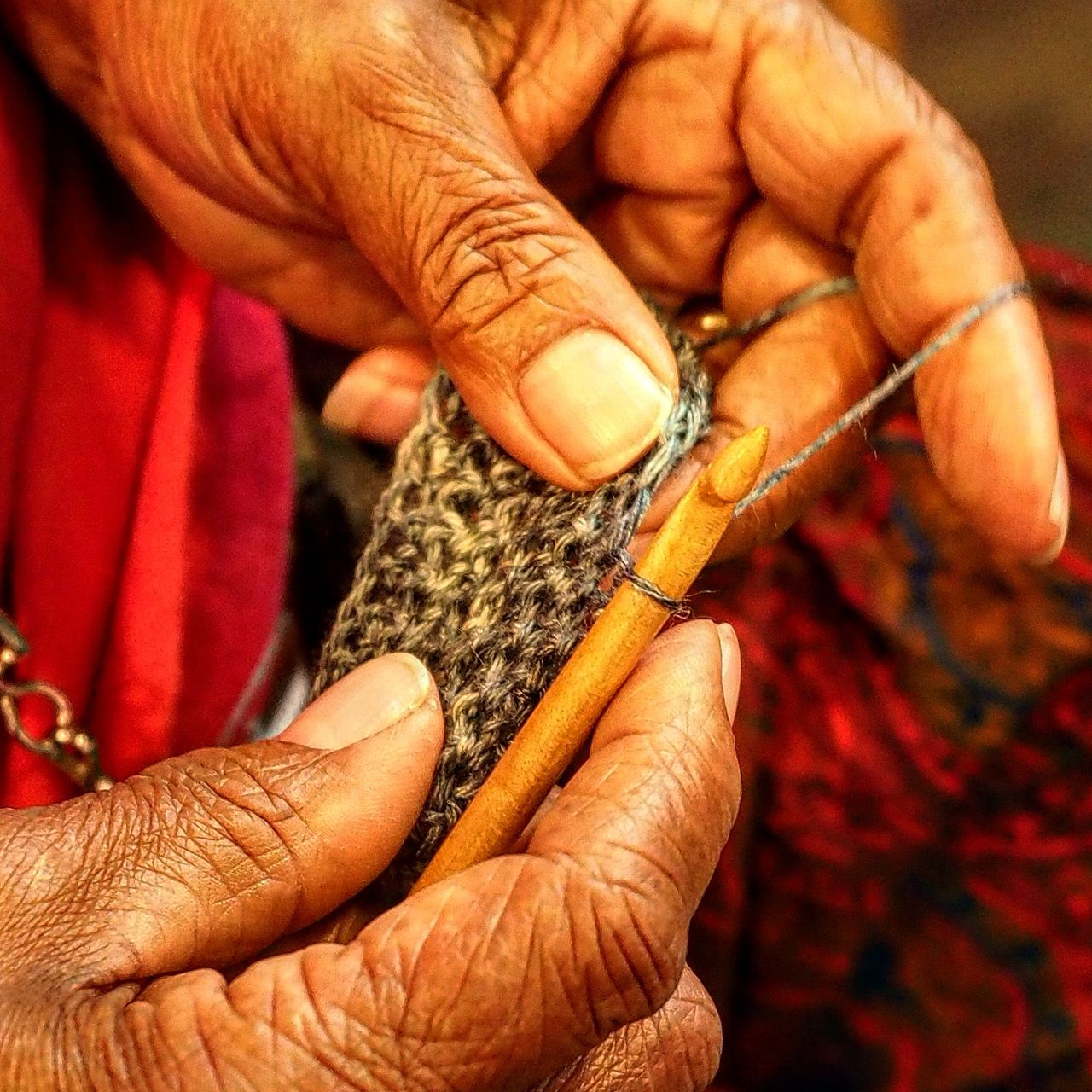 Cropped image of senior woman knitting sweater