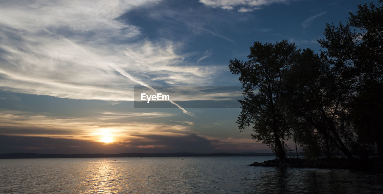 View of calm sea at sunset