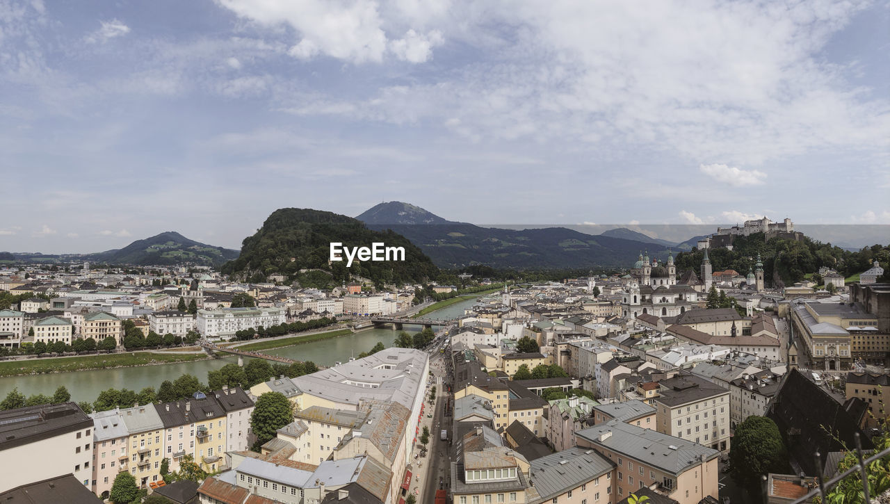 HIGH ANGLE VIEW OF TOWNSCAPE BY RIVER
