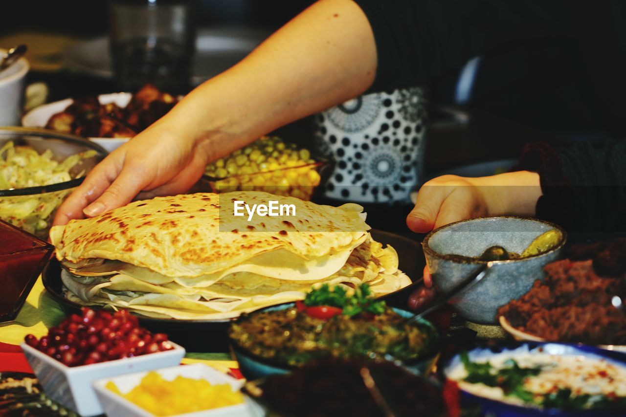 Close-up of women serving food