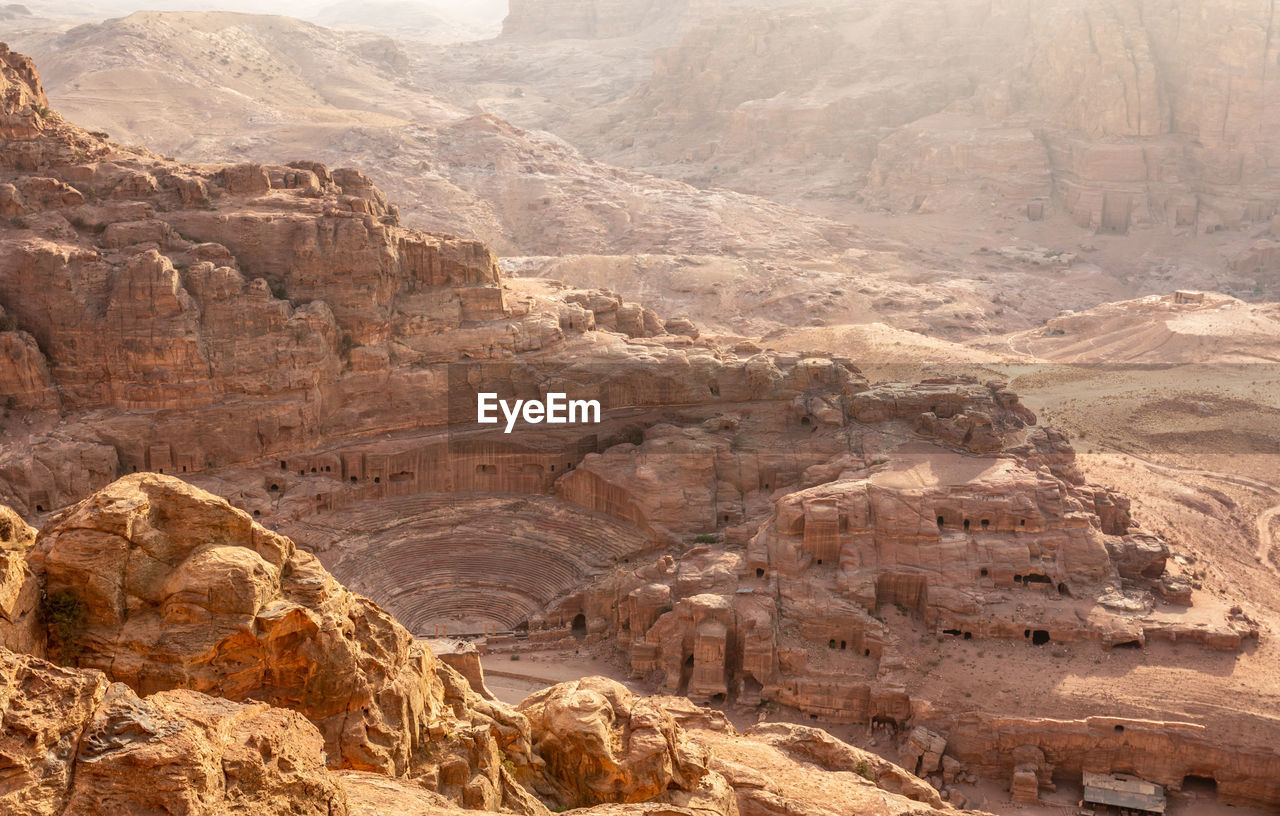 View from the above to the nabataean theatre carved in stone and surrounding tombs, petra, jordan