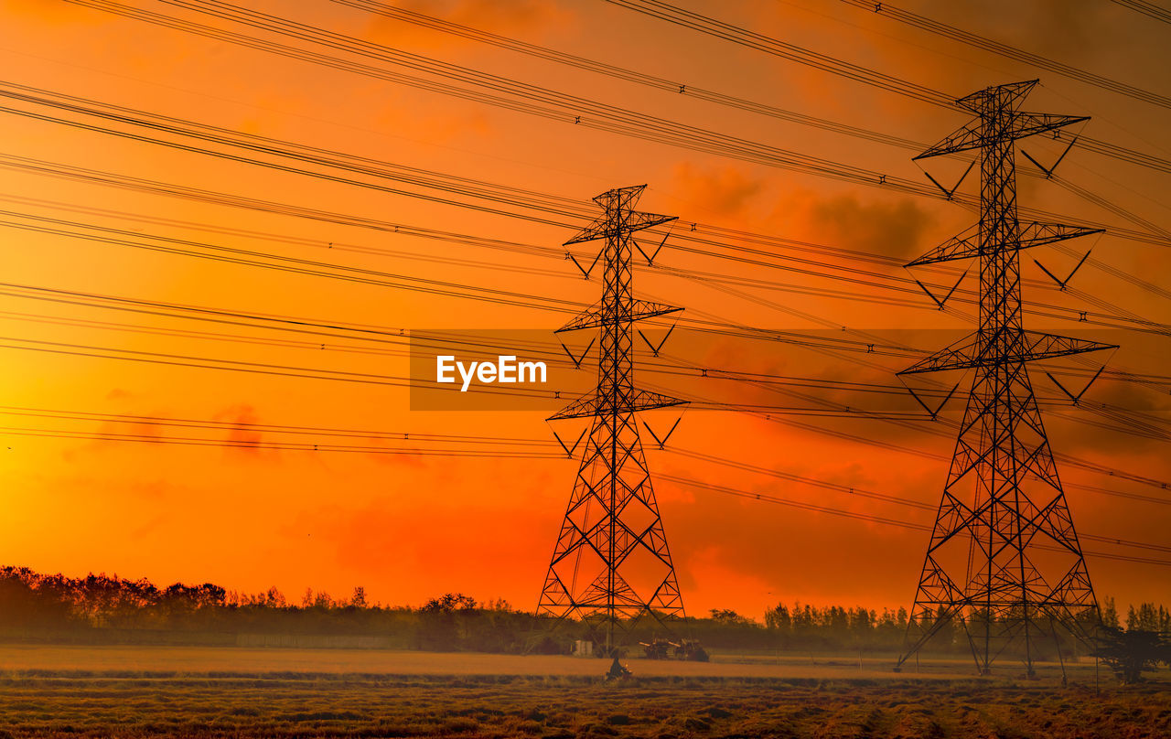 High voltage electric pylon and electrical wire with sunset sky. electricity poles. power and energy
