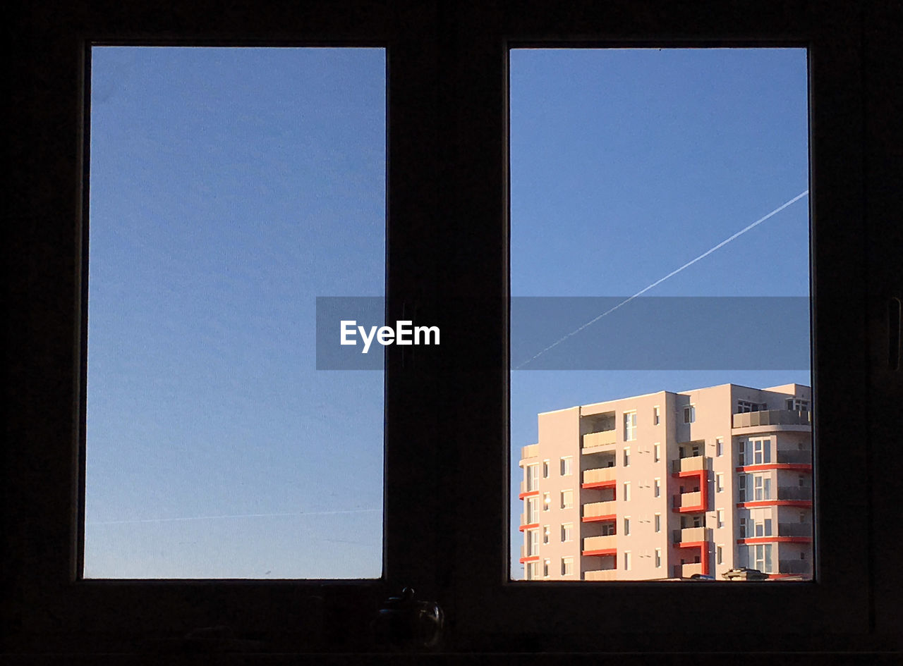 VIEW OF BLUE SKY THROUGH WINDOW