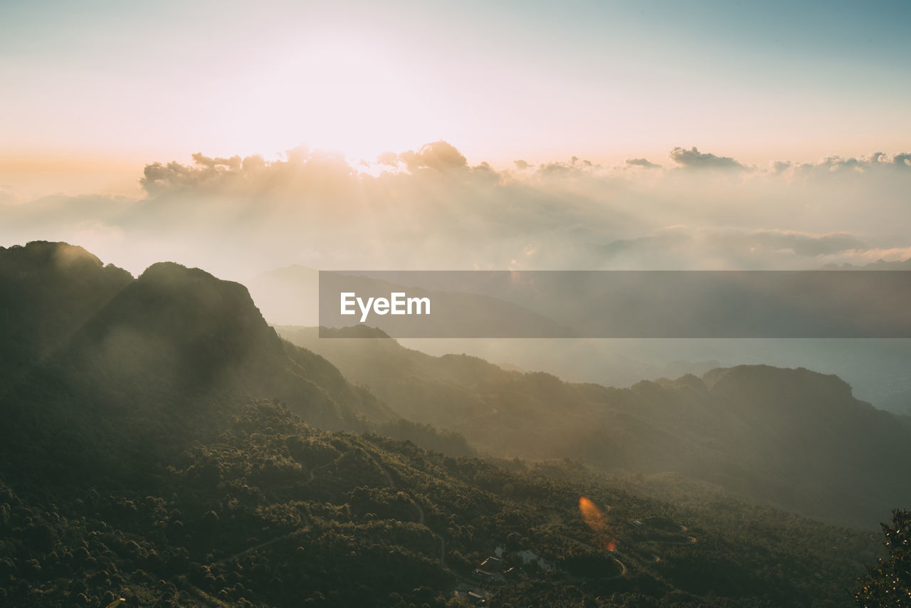 Scenic view of mountains against sky during sunset