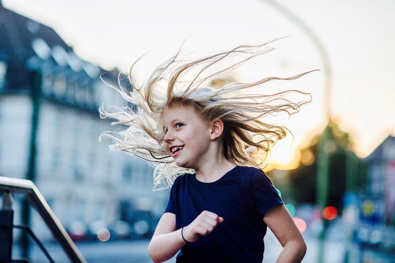 Girl running and smiling