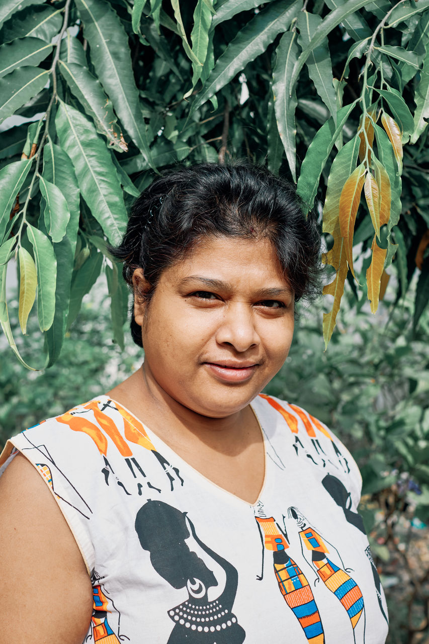 Portrait of a beautiful indian girl in garden, dressed in ethnic casual. shot in natural light